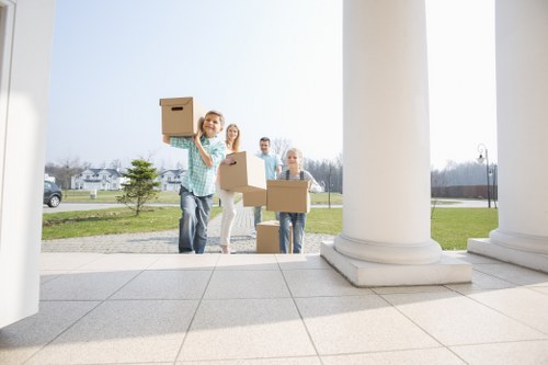 Professional movers handling furniture during a Barnet flat relocation